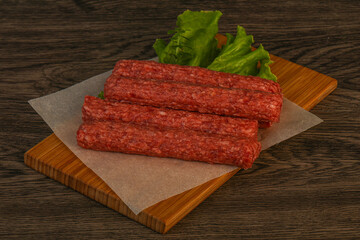 Raw beef sausages with spices