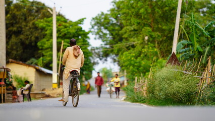 old man playing cycle at street