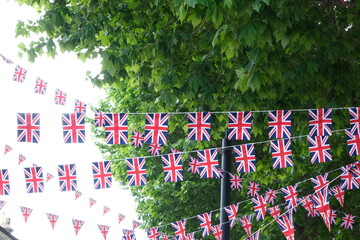 British flags hanging on the streets of London. Union jack flag triangular outside decoration