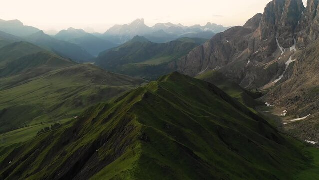 Aerial video of the sunrise in the Dolomites mountains. It was shot on the beautiful meadows of the Seiser Alm plateau with fog and mist in the morning.

