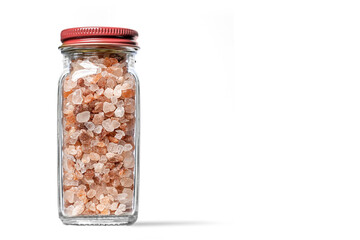 Himalayan pink salt in Spice Rack Glass bottle with red cap isolated on white background with room...