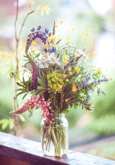 Bouquet of summer wildflowers in pastel colors. Summer mood