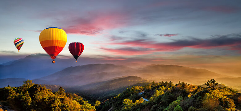 Floating hot air balloons in colorful sky on sunset mountain view, Chiang Mai Thailand