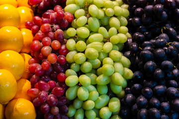 Colorful fruit berries are displayed in a market