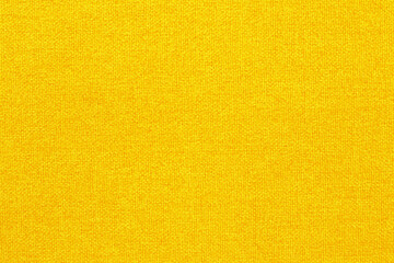 Naklejka premium Yellow golden fabric cloth texture background, seamless pattern of natural textile.