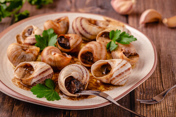 snails with butter on a plate