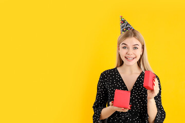 Concept of Happy Birthday with attractive girl on yellow background