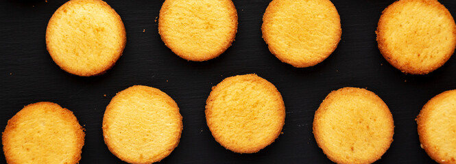 Homemade Pure Butter Shortbreads on a black background, top view. Flat lay, overhead, from above.