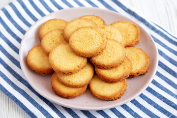 Homemade Pure Butter Shortbreads on a Pink Plate, side view. Close-up.