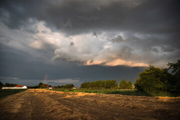Dramatic sky with thunderstom over small village in Transylvania.