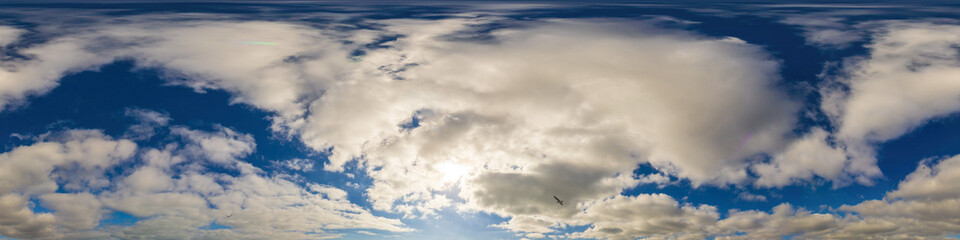 Blue sky panorama with puffy Cumulus clouds. Seamless hdr pano in spherical equirectangular format. Sky dome or zenith for 3D visualization, game and sky replacement for aerial drone 360 panoramas.