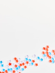 4th of July American Independence Day decorations on white background. flat lay minimalistic compositions, space for text, vertical frame