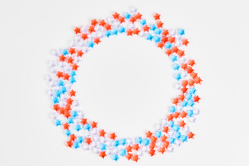 beautiful frame of blue, red and transparent stars on a white background. banner for the celebration of Independence Day on July 4th. space for text, flat lay