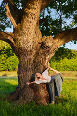 Young woman yoga practitioner in the forest