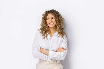 Happy young business woman posing isolated over grey wall backgr