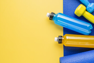 Isotonic energy drink. Bottle with blue and yellow transparent electolytes liquid, sport beverage...