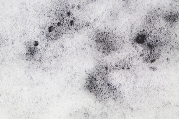 White foam on black background 