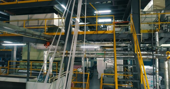 Modern shop of nonwoven materials. industrial interior. Workshop of the non-woven fabrics factory. Production of nonwoven materials.