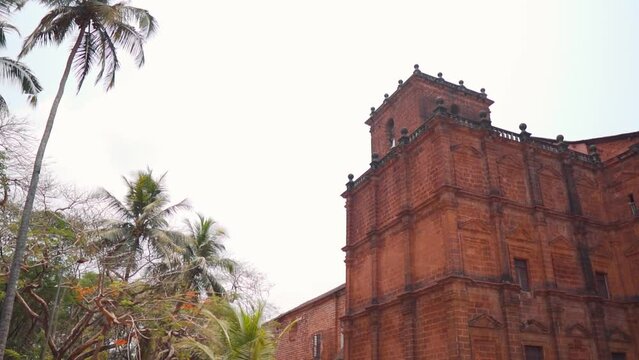 Wide angle shot of Basilica of Bom Jesus on a clear sunny day at Goa in India. Ancient catholic church which is also an UNESCO world heritage site at Panjim in Goa. Ancient church made by Portuguese. 