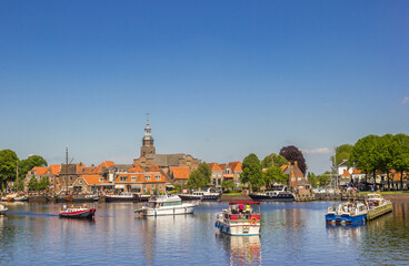 Fototapeta na wymiar Ships waiting for the lock in historic fishing village Blokzijl, Netherlands