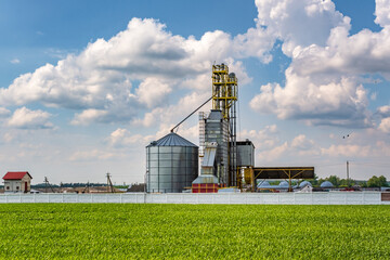 agro silos granary elevator on agro-processing manufacturing plant for processing drying cleaning and storage of agricultural products, flour, cereals and grain.