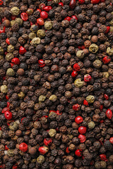 Aromatic peppercorn mix as background, top view