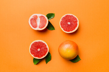 fresh Fruit grapefruit with Juicy grapefruit slices on colored background. Top view. Copy Space. creative summer concept. Half of citrus in minimal flat lay with copy space