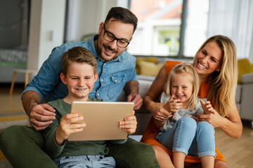 Device technology family online education concept. Happy family with digital devices at home.