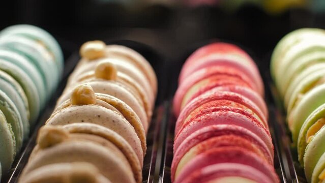 Colorful Sweet French Macaron copy space. Cakes in Row on Cafe Display closeup. Sets of desserts from Almond Dough in Pastry. Macaroon Dessert In Bakery Shop