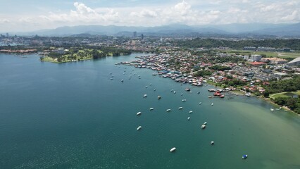 Kota Kinabalu, Sabah Malaysia – June 15, 2022: The Tanjung Aru Beach, Fisherman Village and Shangri-La Hotel