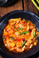 colorful turkey fricassee with asparagus and paprika