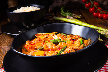 colorful turkey fricassee with asparagus and paprika