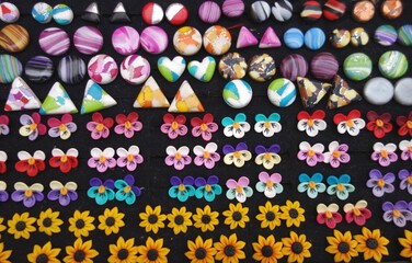polymer earrings handmade with colorful design flower circle rose on black background