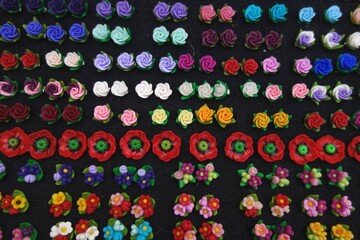 polymer earrings handmade with colorful design flower circle rose on black background