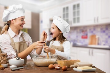 Happy young family eating in the room