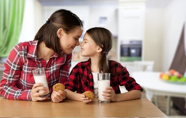 Happy young family eating in the room