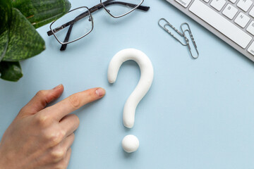 Question mark sign made of plasticine. FAQ and help concept