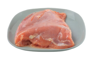 Turkey fillet in plate isolated in white background. Raw meat for cooking.