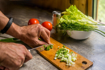 Healthy Lifestyle. Man Cooking Green Salad Of Romaine Lettuce. Healthy Food concept