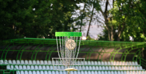 Successful shot in the disc golf basket