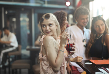 group of young people in a bar