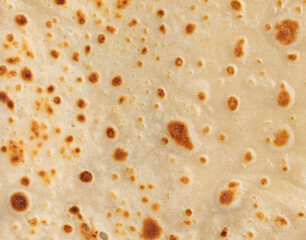 Pan fried pancake as a background.