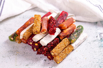 Turkish delight varieties on a concrete floor. Traditional Turkish delicacies. local name parmak lokum. close up