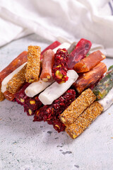 Turkish delight varieties on a concrete floor. Traditional Turkish delicacies. local name parmak lokum. close up
