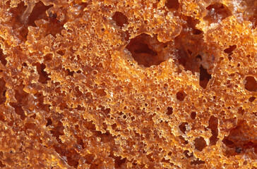 Crust on ruddy cookies as an abstract background.