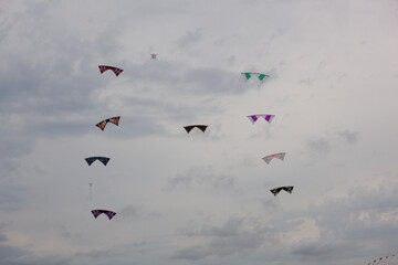 Kite in the sky, Wind Festival Penvins Sarzeau, Fête du Vent. Nine individual kites follow each other in a perfect ballet.