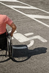 Obraz premium Wheelchair Handicap Sign and shadow from a person in a wheelchair , driver with disability