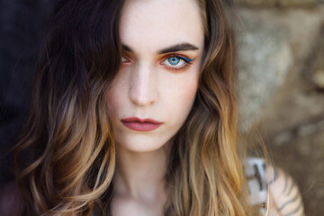 Portrait of young beautiful woman. Natural light. Shallow depth of field.