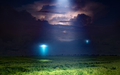 Scenic sci-fi image: UFO or alien spacecraft  inspect green grass field with bright spotlight in...