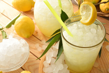 Detail of lemonade with ice on wooden table close up - obrazy, fototapety, plakaty